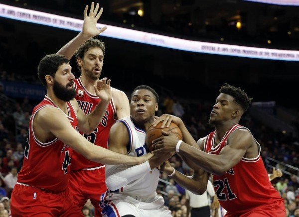 Philadelphia 76ers Richaun Holmes second from right tries to hang onto the ball against Chicago Bulls Jimmy Butler from right Pau Gasol and Nikola Mirotic in the first half of an NBA basketball game Monday Nov. 9 2015 in Philadelphia. (AP