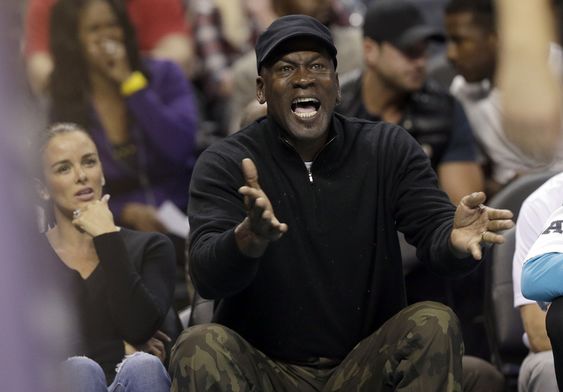 Michael Jordan argues a call with an official during the first half of his team's NBA basketball game against the Chicago Bulls in Charlotte N.C. Tuesday Nov. 3 2015