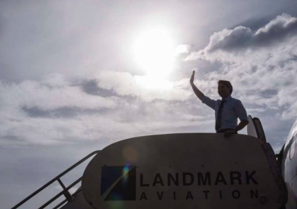 Justin Trudeau silhouetted boarding plane