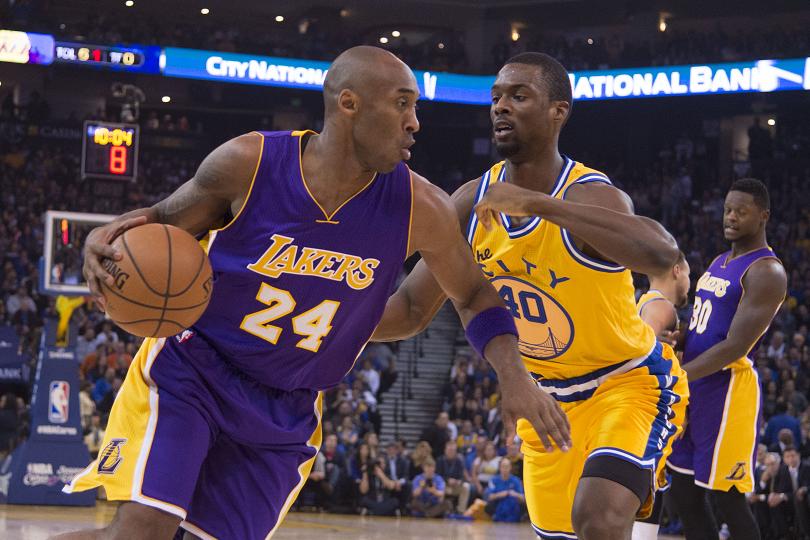 Los Angeles Lakers forward Kobe Bryant dribbles the basketball against Golden State Warriors forward Harrison Barnes during the first quarter at Oracle Arena. – Reuters pic