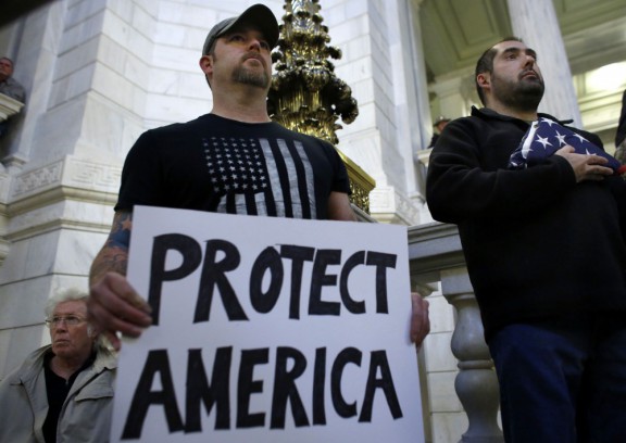 Protesters in Providence R.I. demonstrate against allowing Syrian refugees to enter the state after the Paris attacks