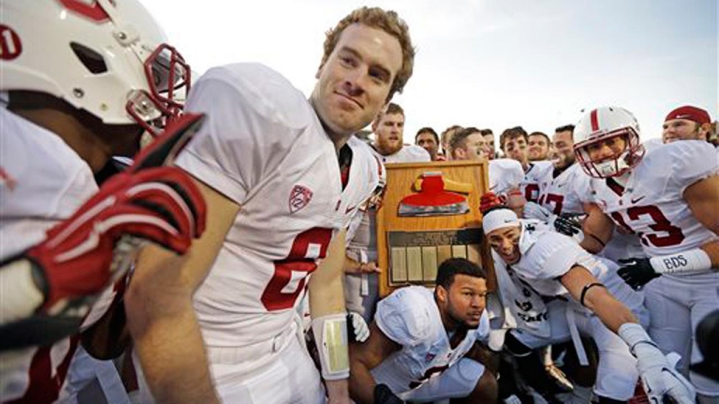 Stanford players including quarterback Kevin Hogan celebrate with the Stanford Axe after defeating California 38-17 after an NCAA college football game Saturday Nov. 22 2014