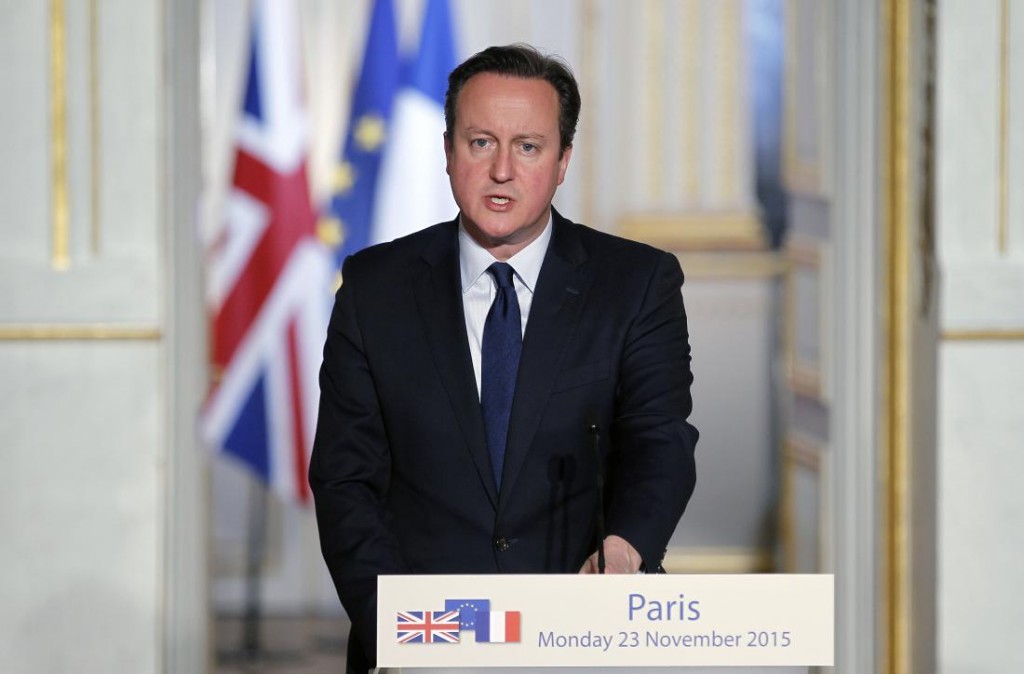 British Prime Minister David Cameron issues a statement during a press conference with French President Francois Hollande at the Elysee Palace