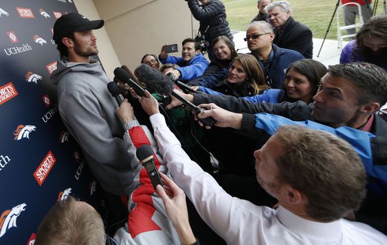 Brock Osweiler left talks to reporters after an NFL football practice at the team's headquarters Wednesday Nov. 25 2015 in Englewood Colo