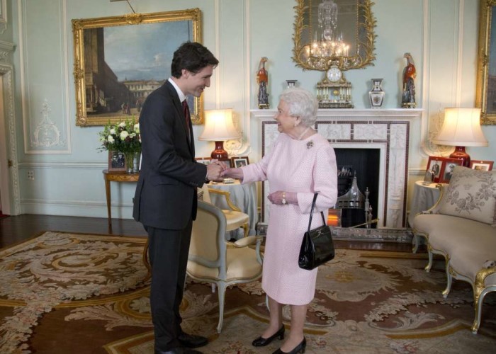 Prime Minister Justin Trudeau meets Canada's Queen Elizabeth II during a private audience at Buckingham Palace London on Wednesday Nov. 25 2015