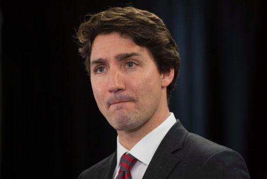 Prime Minister Justin Trudeau listens to a question as he speaks with the media during an availability at Canada House in London U.K. on Wednesday