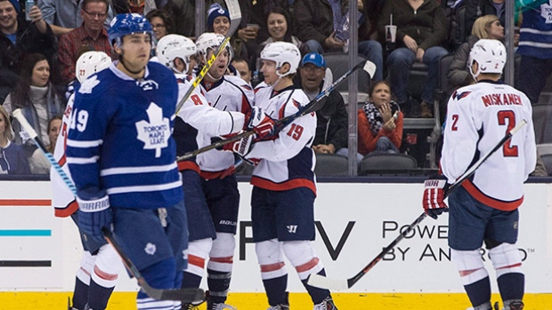 Washington Capitals forward Tom Wilson centre celebrates with teammates after scoring his team's second goal against the Toronto Maple Leafs in Toronto on Saturday