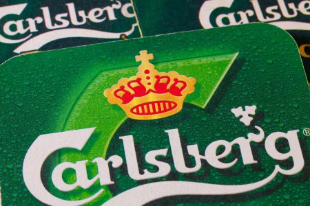 DENMARK: Carlsberg Announces Job Cuts After Q3 Loss