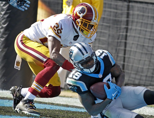 Carolina Panthers Ted Ginn catches a touchdown pass as Washington Redskins Bashaud Breeland defends in the first half of an NFL football game in Charlotte N.C. Sunday Nov. 22 2015