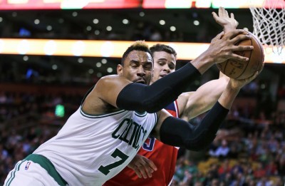 Celtics forward Jared Sullinger grabs a rebound over Washington’s Kris Humphries during the Boston’s 118-98 win