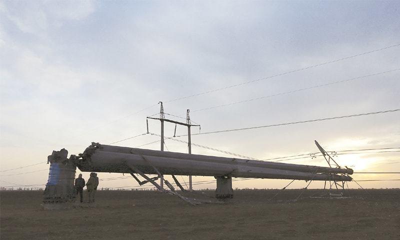 Chaplynka: A view of a damaged electrical pylon here on Sunday.—Reuters