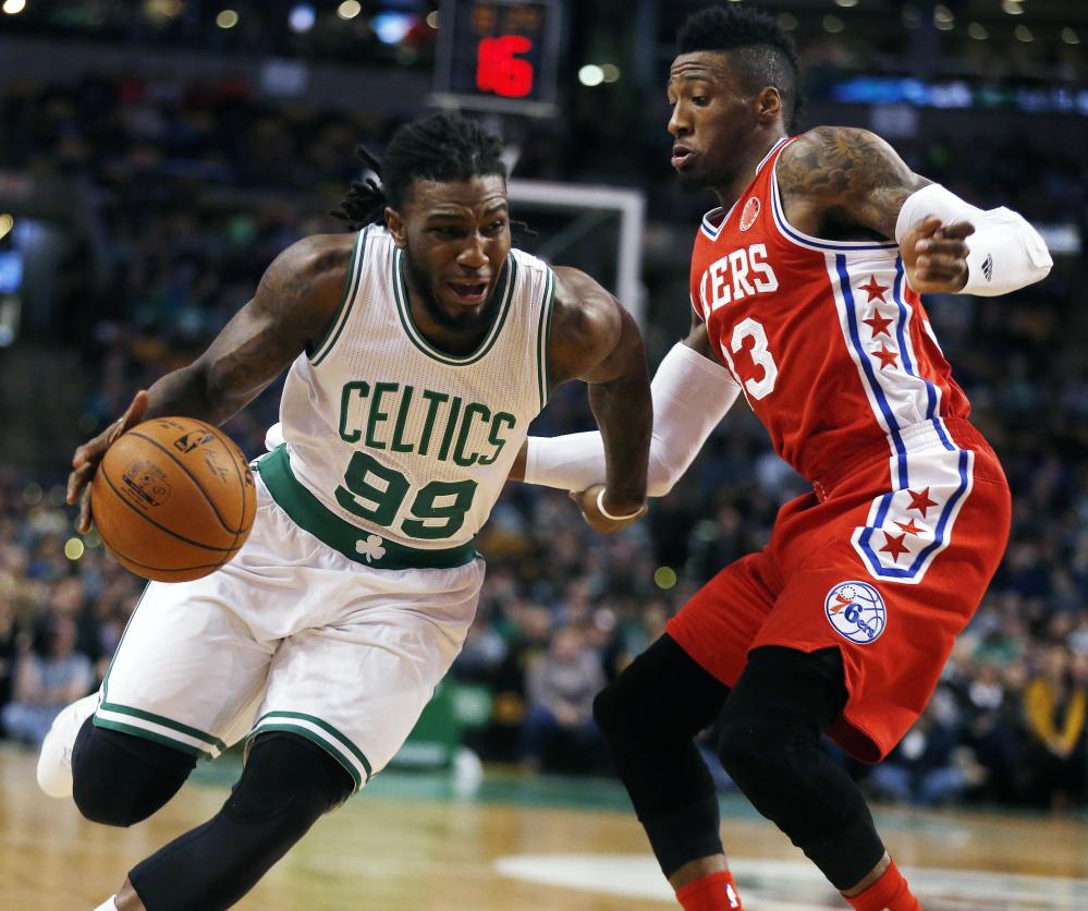 The Celtics’ Jae Crowder drives past the 76ers’ Robert Covington in the first quarter of Wednesday’s night’s game in Boston. Crowder hit the game-winning 3-pointer for the Celtics in the final minute