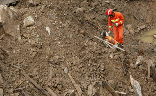 The death toll from a landslide triggered by flooding in China has risen to 38