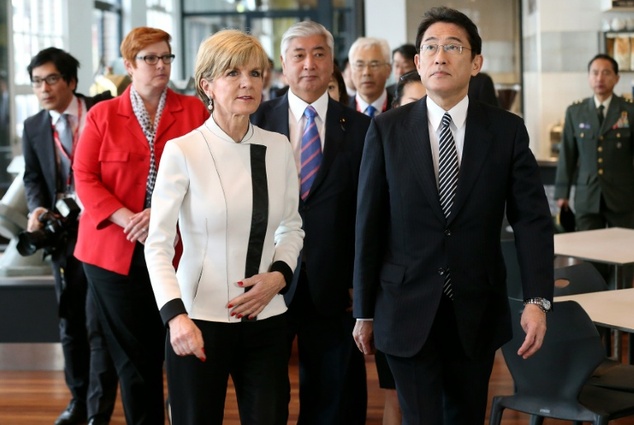 Australia's Foreign Minister Julie Bishop walks with Japan's Foreign Minister Fumio Kishida during a visit to the Royal Australian Navy Heritage Centre