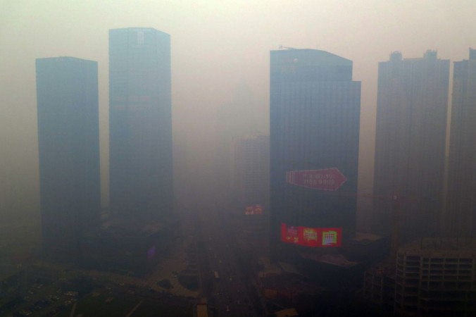 8 2015 shows a residential block covered in smog in Shenyang China's Liaoning province. A swathe of China was blanketed with dangerous acrid smog after levels of the most dangerous particulates reached almost 50 times Wor