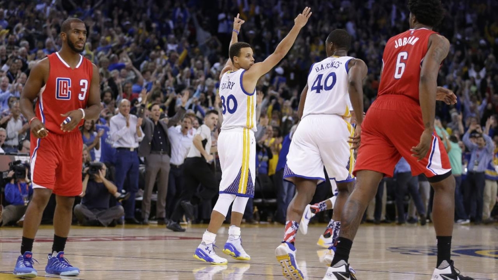 Golden State Warriors Stephen Curry celebrates a score against the Los Angeles Clippers during the second half of an NBA basketball game Wednesday Nov. 4 2015 in Oakland