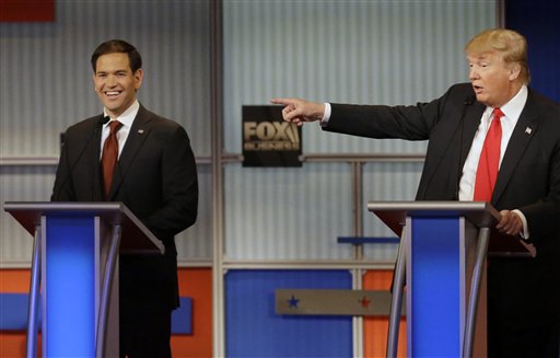 Marco Rubio laughs as Donald Trump makes a point during Republican presidential debate at Milwaukee Theatre Tuesday Nov. 10 2015 in Milwaukee