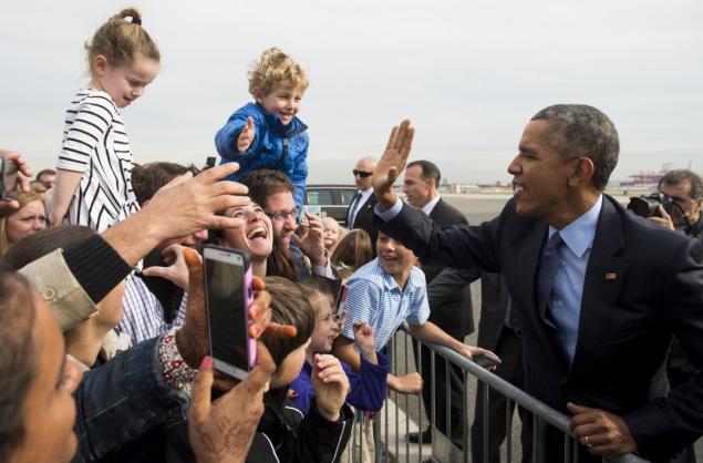 President Obama greets well-wishers upon arrival at Newark Liberty International Airport Monday in New Jersey before he visited Rutgers University and the nearby Integrity House halfway home in Newark