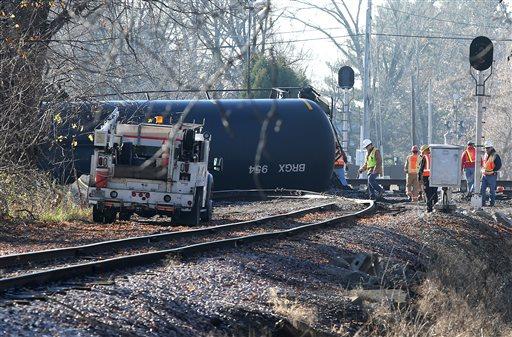 Workers tend to the scene of a train derailment in Watertown Wis. Monday Nov. 9 2015 after a 13 cars of a Canadian Pacific train carrying crude oil overturned Sunday. One of the cars was punctured spilling less than 1,000 gallons of oil. Watertown fir