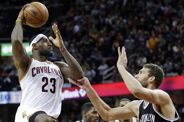 LeBron James hits last-gasp basket as Cavaliers nip Nets to keep home record unblemished