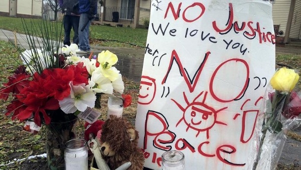 Community members set up a memorial to Jamar Clark where he was shot