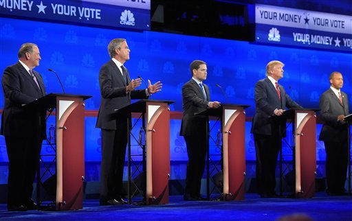 Jeb Bush second from left is flanked by Mike Huckabee left Marco Rubio center Donald Trump second from right and Ben Carson during the CNBC Republican presidential debate at the University of Colorado Wednesday Oct. 28 2015 in Boulder Colo