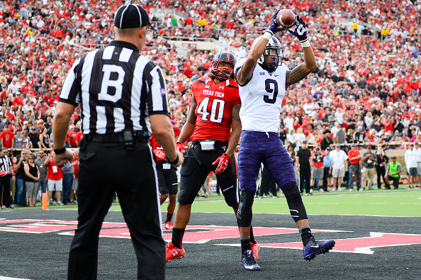 LUBBOCK TX- SEPTEMBER 26 Josh Doctson #9 of the TCU Horned Frogs catches a touchdown pass during the first quarter action against the Texas Tech Red Raiders