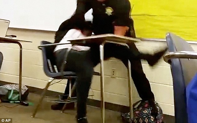 Cop Ben Fields was caught grabbing a black 16-year-old and flipping her out of her chair before slamming her on the ground arresting her