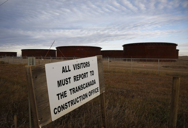 A sign is posted in front of TransCanada's Keystone pipeline facilities are in Hardisty Alberta Canada on Friday Nov. 6 2015. Following the Obama administration ™s rejection of the Keystone XL pipeline the oil industry faces the tricky task of