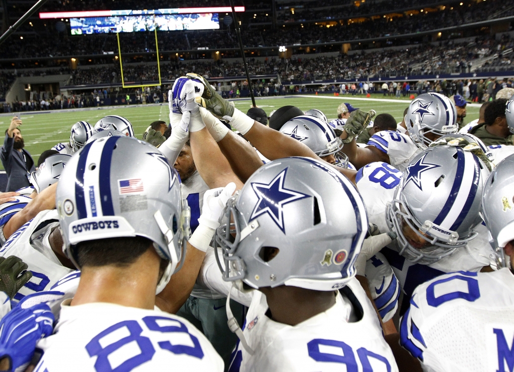 The Dallas Cowboys huddle on the field during warmups before an NFL football game against the Philadelphia Eagles Sunday Nov. 8 2015 in Arlington Texas. ORG XMIT CBS109