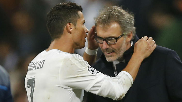 Cristiano Ronaldo whispers into the ear of PSG coach Laurent Blanc. 
    
    
                
          
          Show Grid