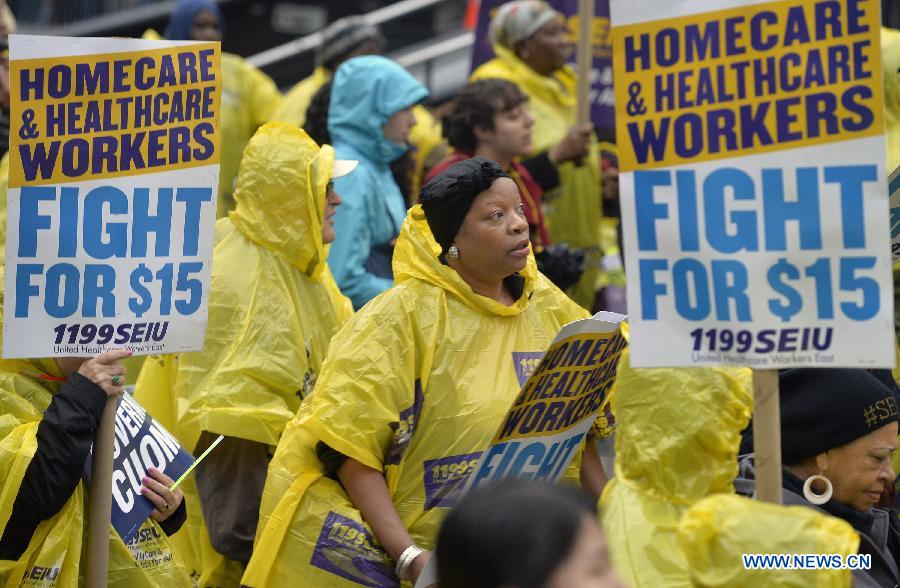 People attend the strike in support of a $15-per-hour minimum wage in New York City the United States Nov. 10 2015