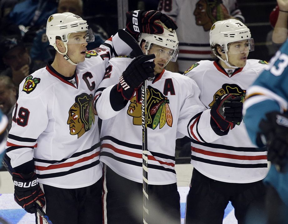 Chicago Blackhawks Duncan Keith celebrates his goal with teammates Jonathan Toews and Artemi Panarin during the second period of an NHL hockey game Wednesday Nov. 25 2015 in San Jose Calif