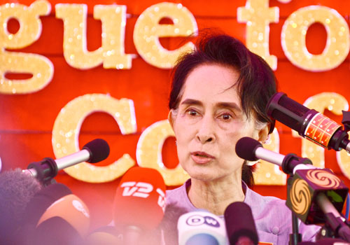 Daw Aung San Suu Kyi speaks to local and foreign journalists in Yangon yesterday