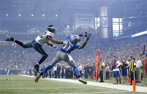 Detroit Lions wide receiver Calvin Johnson, defended by Philadelphia Eagles cornerback Eric Rowe catches a pass for a touchdown during the second half of an NFL football game Thursday Nov. 26 2015 in Detroit