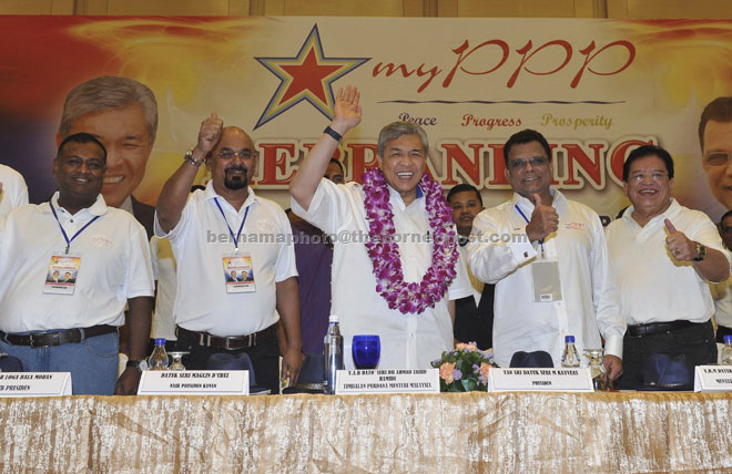 Ahmad Zahid Hamidi and MyPPP president Tan Sri M Kayveas waving at the MyPPP members at the emergency general assembly and rebranding of the People’s Progressive Party 2015 at the Putra World Trade Centre in Kuala Lumpur. — Bernama