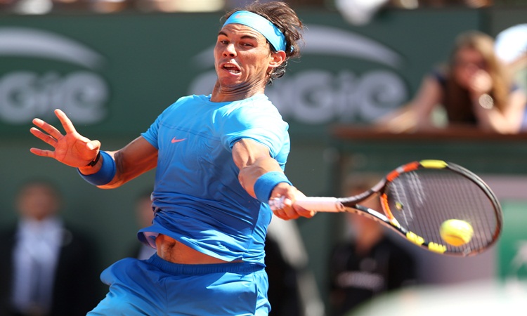 Rafael Nadal of Spain returns the ball to Novak Djokovic of Serbia during the men's singles quarterfinal at 2015 French Open tennis tournament in Paris France