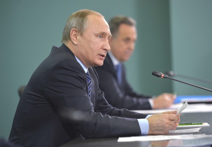 Russian President Vladimir Putin and Sports Minister Vitaly Mutko attend a meeting in Sochi dedicated to the preparations of Russian athletes for the 2016 Olympics in Brazil