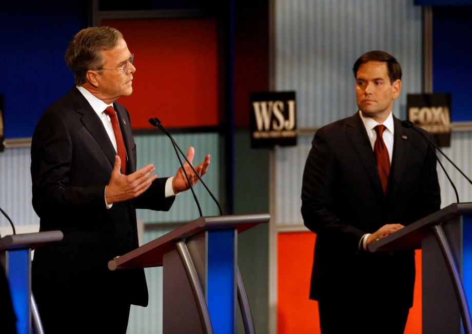 Jeb Bush left speaks as Marco Rubio listens during Republican presidential debate at Milwaukee Theatre Tuesday Nov. 10 2015 in Milwaukee