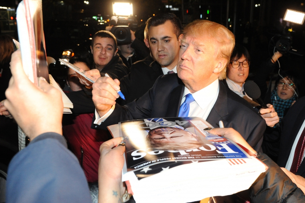 Donald Trump signs autographs outside of Rockefeller Center after his “SNL”