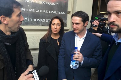 DraftKings CEO Jason Robins center leaves court after a Nov. 25 hearing in New York