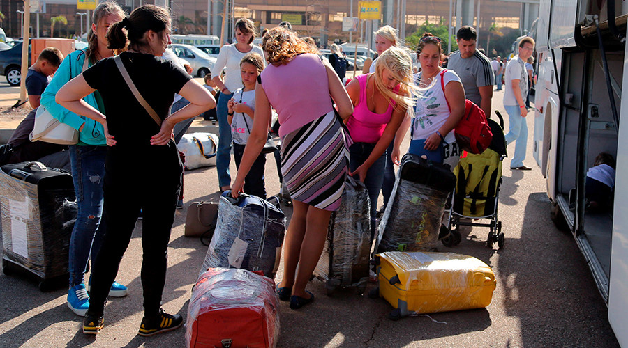 Russian tourists double pack their luggages that will be shipped separately for more security on board the airplane at the airport of the Red Sea resort of Sharm el-Sheikh