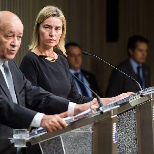 High Representative for Foreign Affairs and Security Policy Federica Mogherini right and France's Defense Minister Jean Yves Le Drian address the media during an EU foreign and defense ministers meeting at the EU Council buil