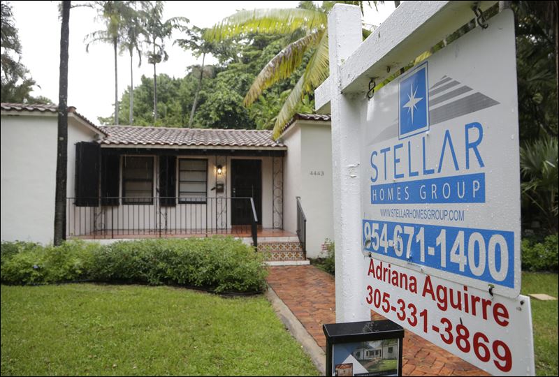 A home is for sale in Coral Gables Fla. Fewer Americans bought homes in October a sign that rising home values may be pushing more would-be buyers to the real estate markets sidelines based on information released today