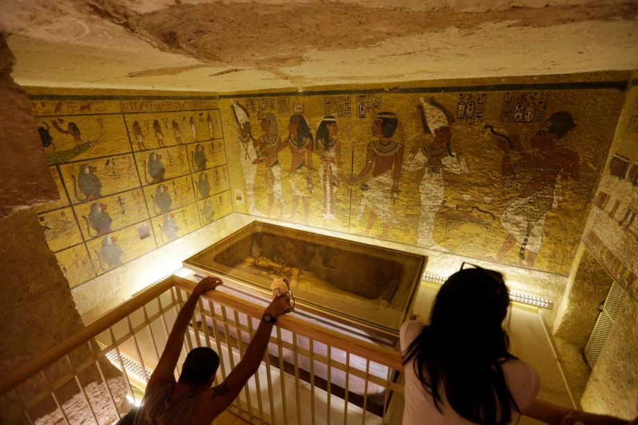 Tourists visit the tomb of King Tutankhamun on display at the Valley of the Kings in Luxor Egypt. Researchers say secret chambers may be hidden in the tomb and could shine new light on one of ancient Egypt's most turbulent times