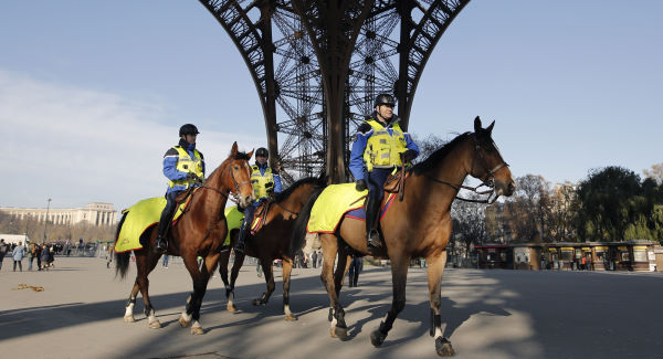 The Latest: French, British leaders visit Paris concert venue in homage to