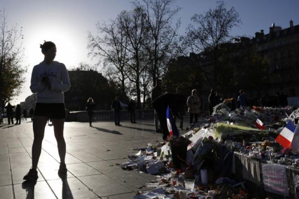 People pay respect to the victims at the