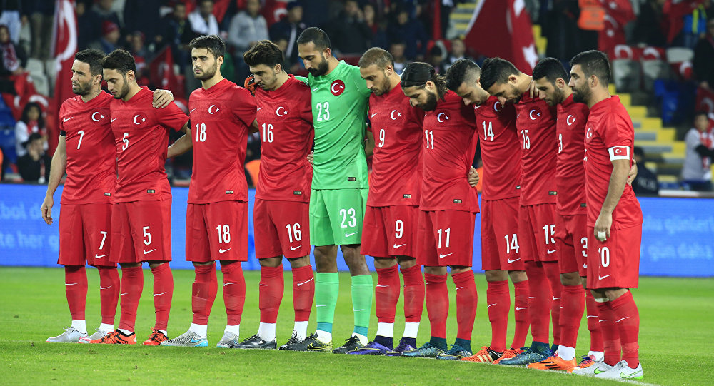 Turkey's players observe a minute of silence to honour the victims of the Paris attacks prior to an international friendly soccer match against Greece in Istanbul Tuesday Nov. 17 2015