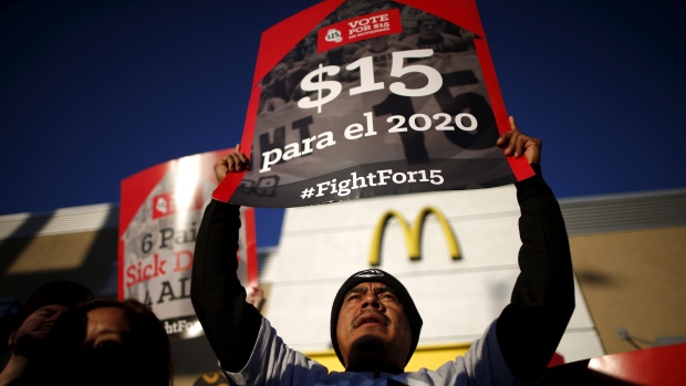 Fast-food workers joined a countrywide protest for higher wages and union rights outside a McDonald's in Los Angeles on Tuesday