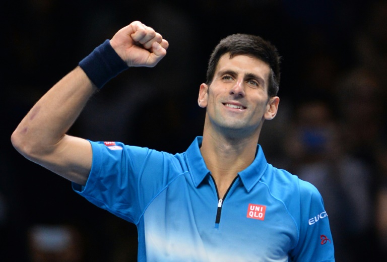 AFP  Glyn Kirk Novak Djokovic celebrates after winning the men's singles final match against Roger Federer on day eight of the ATP World Tour Finals tennis tournament in London